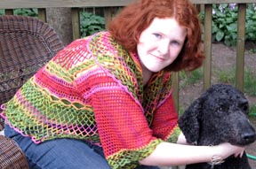 Hannah sits in Poppy Shrug